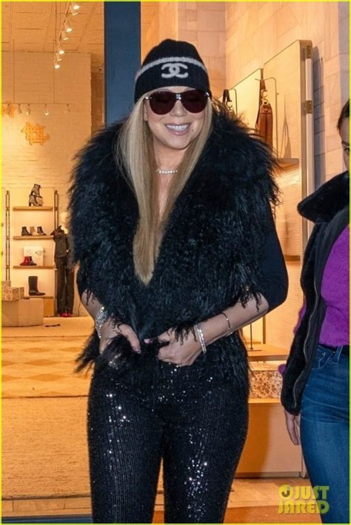 bitchy | Mariah Carey Leaving Gucci Store with Bryan Tanaka in Aspen